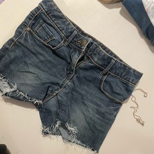 ripped dark blue shorts